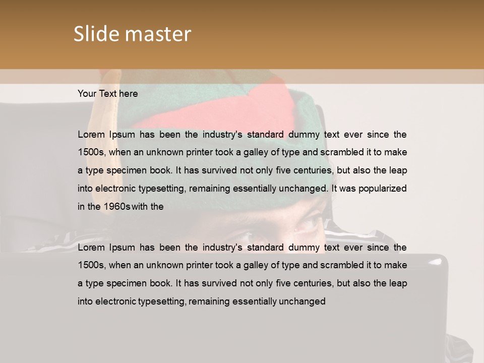 A Man Wearing A Elf Hat Sitting In Front Of A Laptop PowerPoint Template