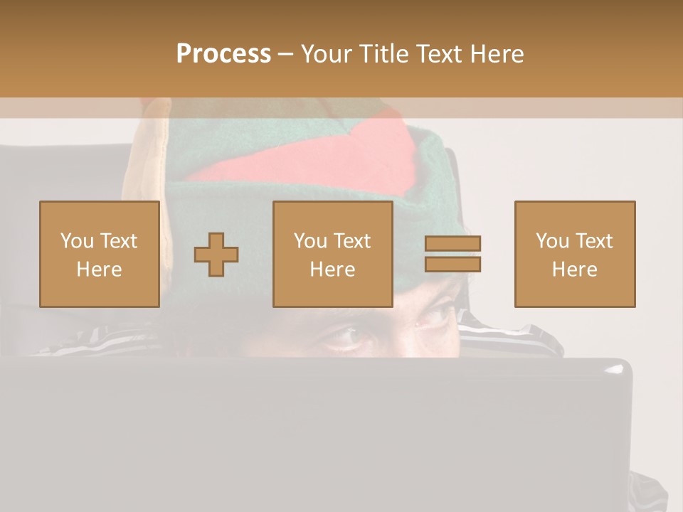 A Man Wearing A Elf Hat Sitting In Front Of A Laptop PowerPoint Template