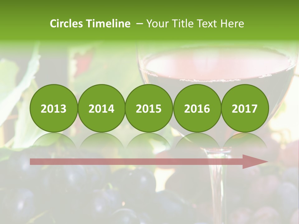 A Glass Of Red Wine Next To A Bunch Of Grapes PowerPoint Template