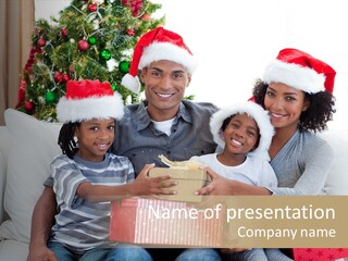 A Family Sitting On A Couch With A Christmas Present PowerPoint Template