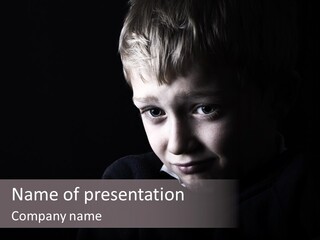 A Young Boy Is Smiling For The Camera PowerPoint Template