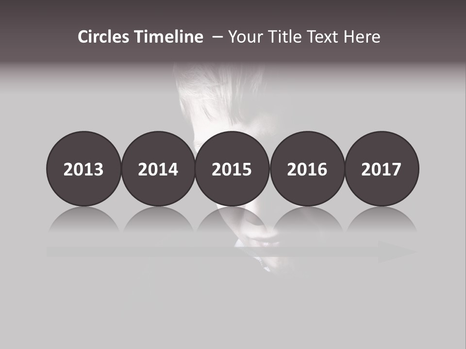 A Young Boy Is Smiling For The Camera PowerPoint Template