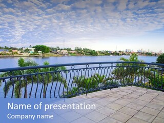A Balcony Overlooking A Body Of Water With Palm Trees PowerPoint Template