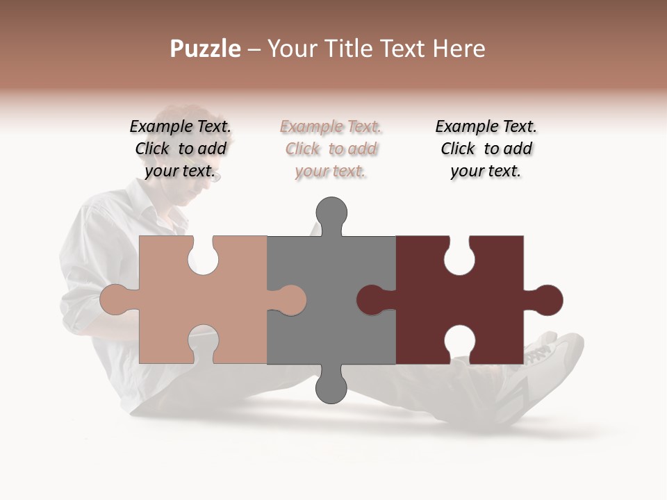 A Man Sitting On The Floor Using A Laptop Computer PowerPoint Template