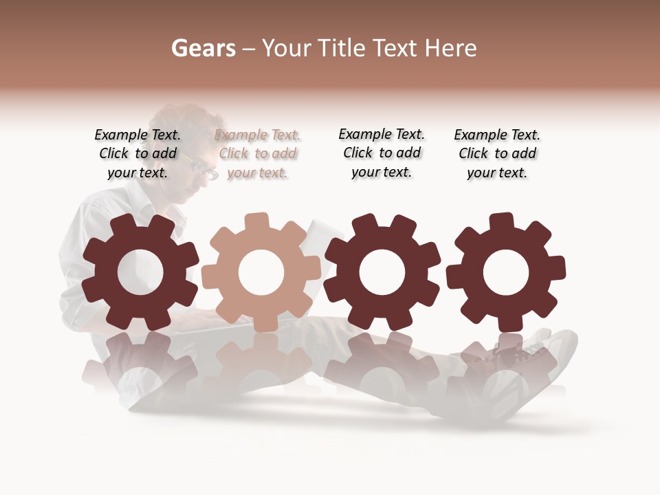 A Man Sitting On The Floor Using A Laptop Computer PowerPoint Template