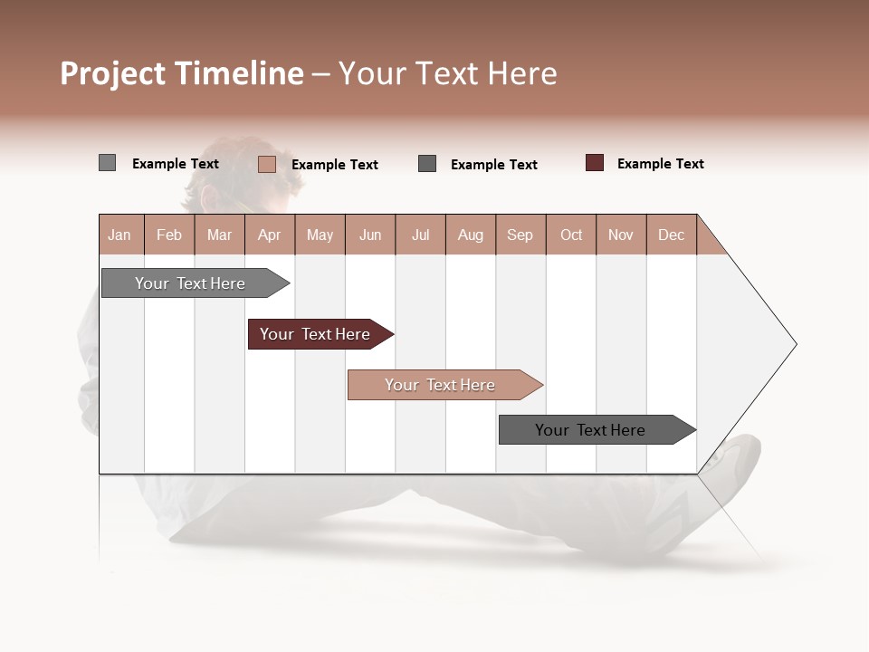 A Man Sitting On The Floor Using A Laptop Computer PowerPoint Template