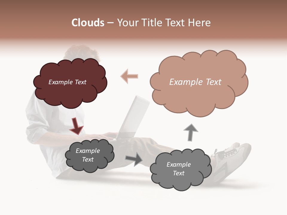 A Man Sitting On The Floor Using A Laptop Computer PowerPoint Template