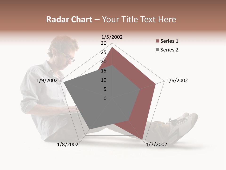 A Man Sitting On The Floor Using A Laptop Computer PowerPoint Template