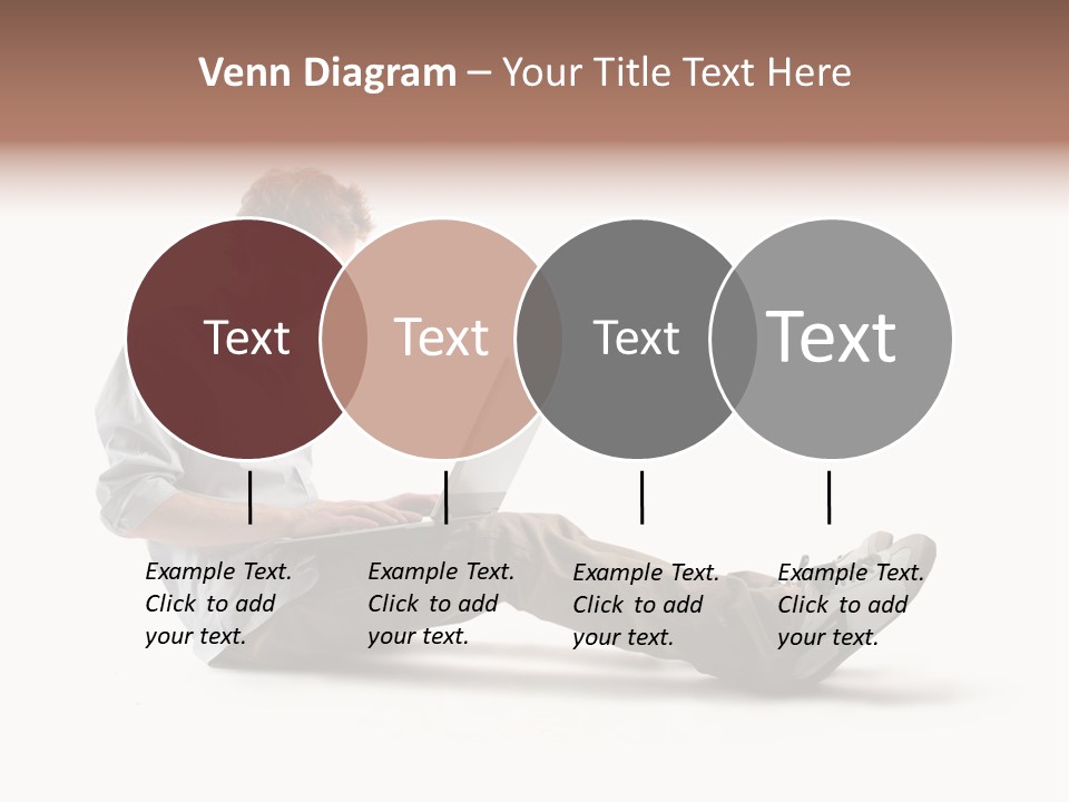 A Man Sitting On The Floor Using A Laptop Computer PowerPoint Template