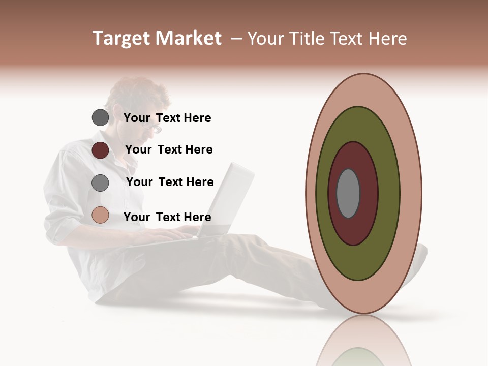 A Man Sitting On The Floor Using A Laptop Computer PowerPoint Template