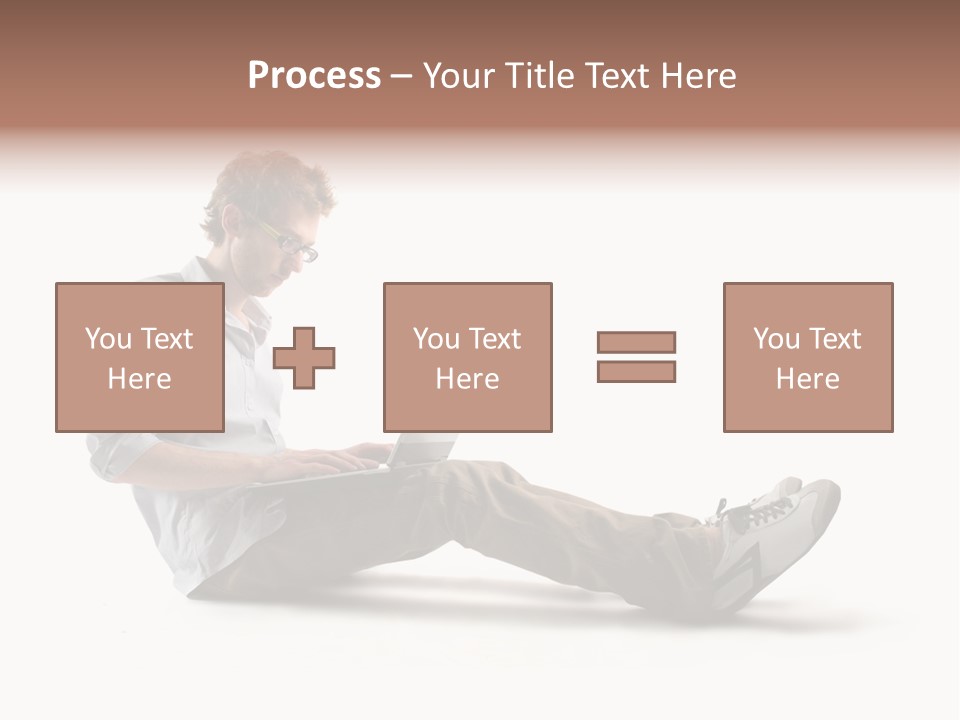 A Man Sitting On The Floor Using A Laptop Computer PowerPoint Template