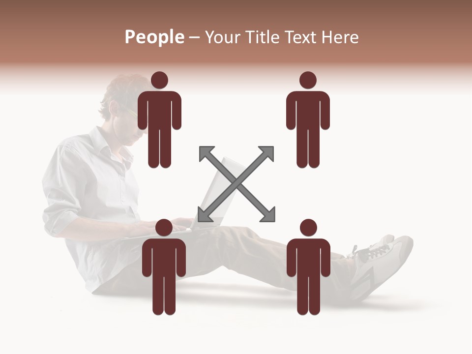 A Man Sitting On The Floor Using A Laptop Computer PowerPoint Template