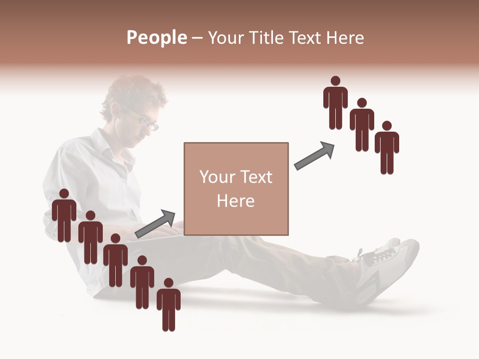 A Man Sitting On The Floor Using A Laptop Computer PowerPoint Template