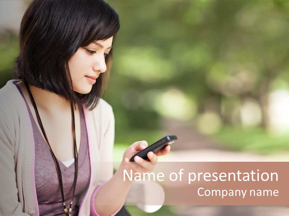 A Woman Is Looking At Her Cell Phone PowerPoint Template