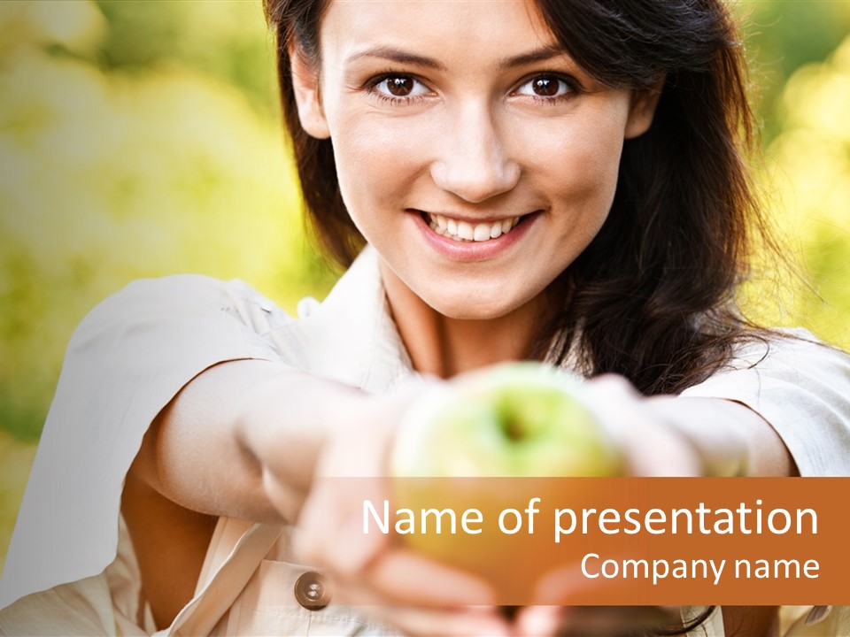 A Woman Holding A Green Apple In Her Hand PowerPoint Template