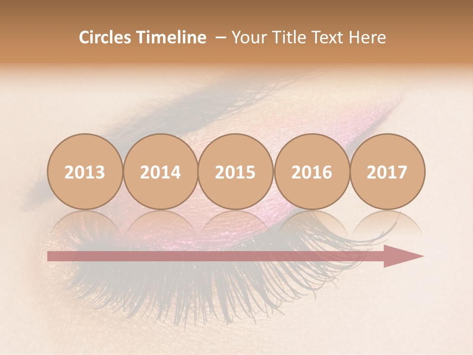 A Close Up Of A Woman's Eye With Pink And Yellow Makeup PowerPoint Template