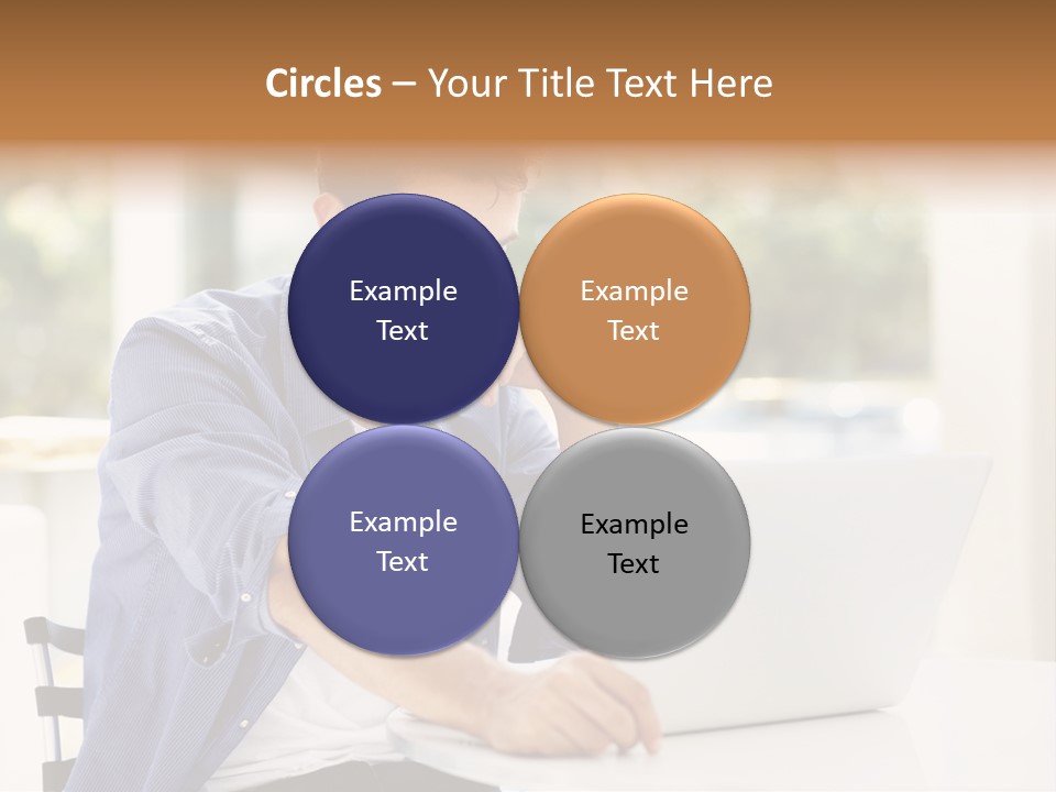 A Man Sitting In Front Of A Laptop Computer PowerPoint Template