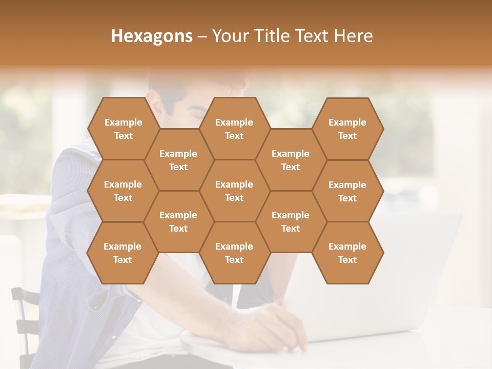 A Man Sitting In Front Of A Laptop Computer PowerPoint Template