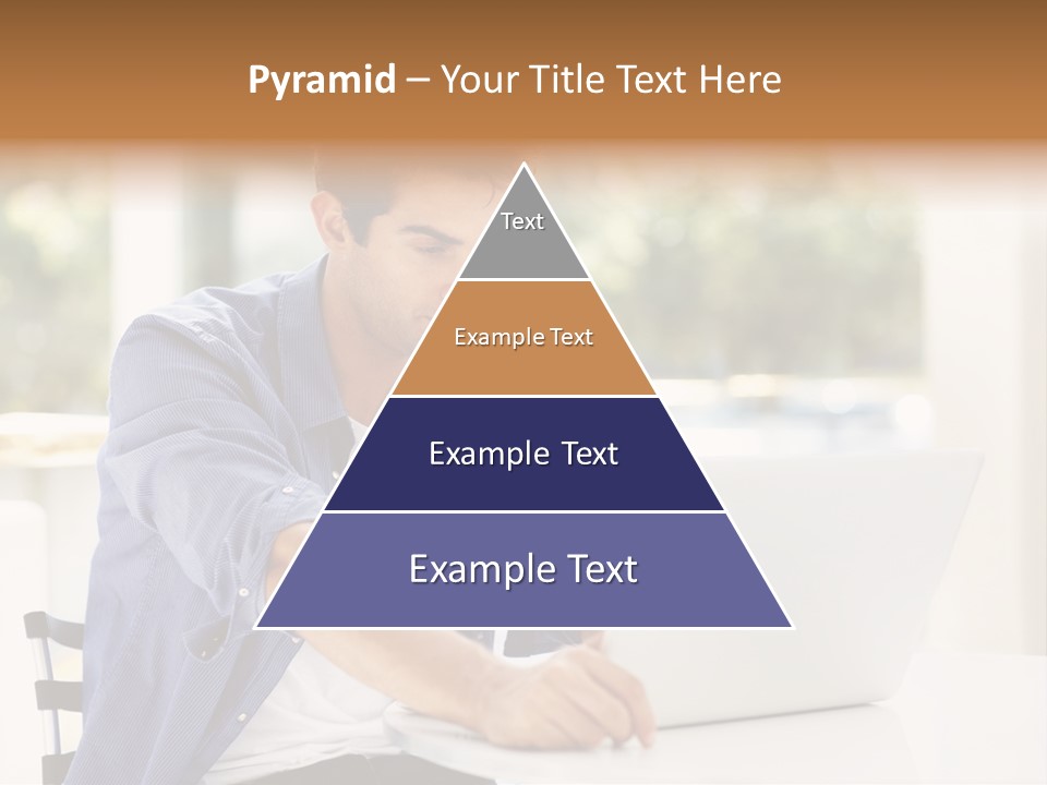 A Man Sitting In Front Of A Laptop Computer PowerPoint Template
