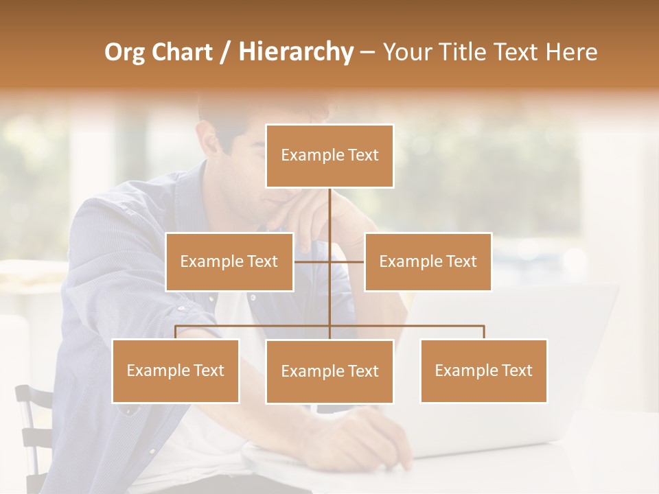 A Man Sitting In Front Of A Laptop Computer PowerPoint Template