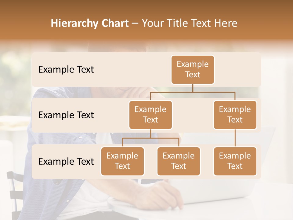 A Man Sitting In Front Of A Laptop Computer PowerPoint Template