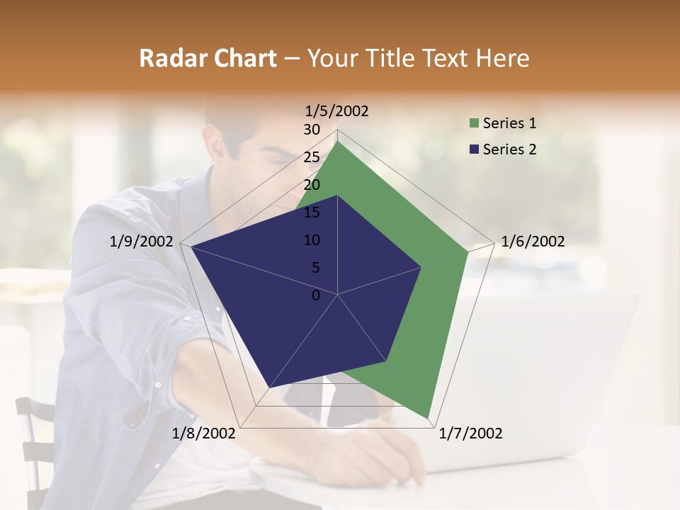 A Man Sitting In Front Of A Laptop Computer PowerPoint Template