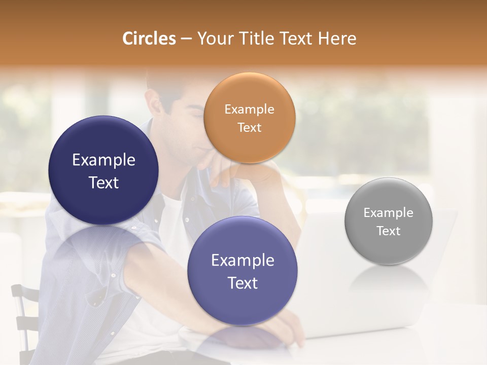 A Man Sitting In Front Of A Laptop Computer PowerPoint Template