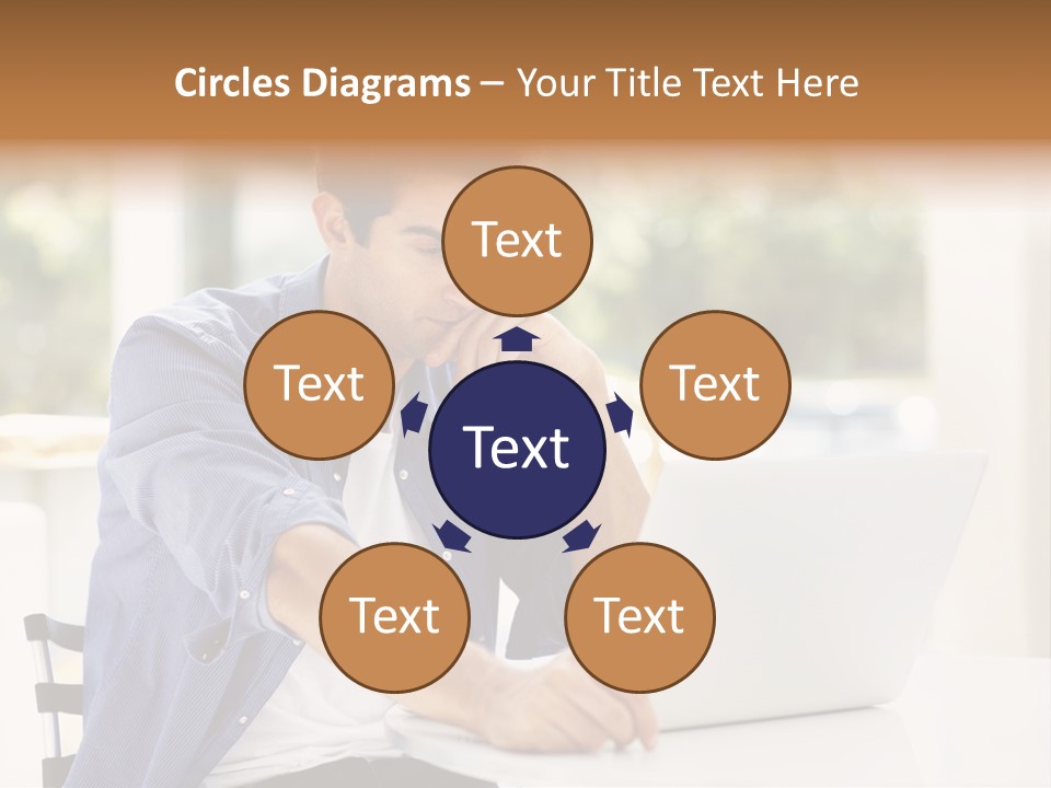 A Man Sitting In Front Of A Laptop Computer PowerPoint Template