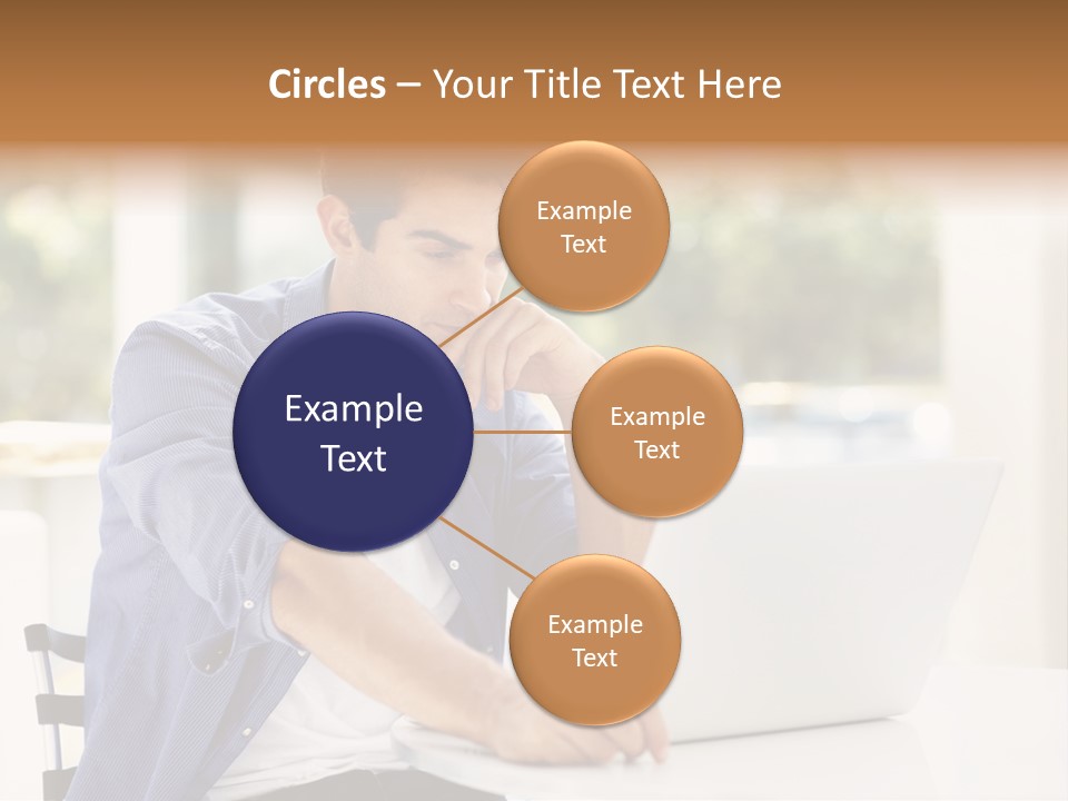 A Man Sitting In Front Of A Laptop Computer PowerPoint Template