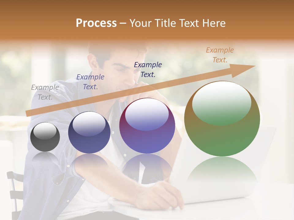 A Man Sitting In Front Of A Laptop Computer PowerPoint Template