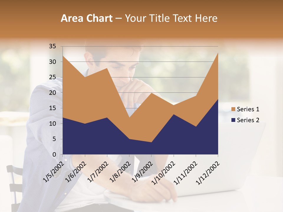 A Man Sitting In Front Of A Laptop Computer PowerPoint Template