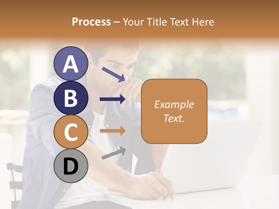 A Man Sitting In Front Of A Laptop Computer PowerPoint Template