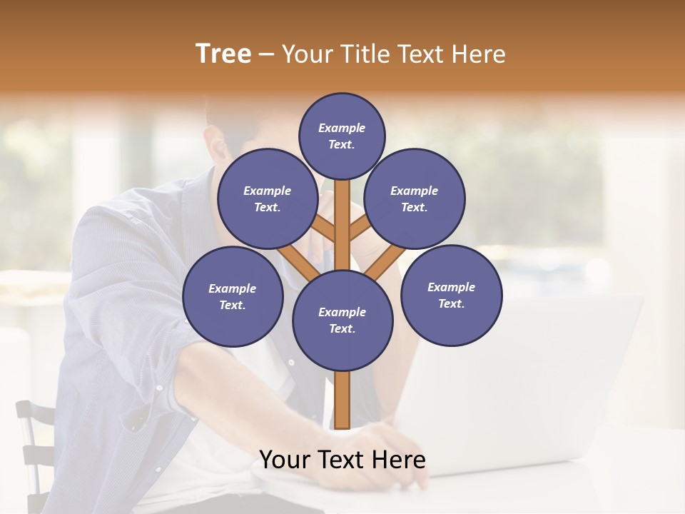 A Man Sitting In Front Of A Laptop Computer PowerPoint Template