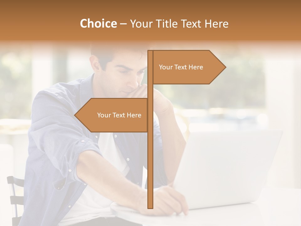 A Man Sitting In Front Of A Laptop Computer PowerPoint Template