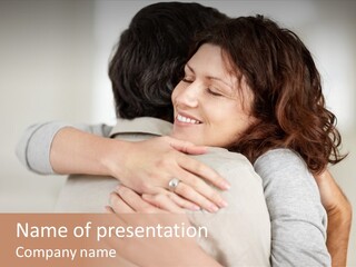 A Woman Hugging A Man With A Smile On His Face PowerPoint Template