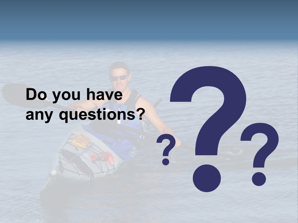A Man Is Paddling A Kayak In The Water PowerPoint Template