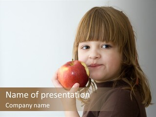 A Little Girl Holding An Apple In Her Hand PowerPoint Template