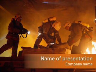 A Group Of Fire Fighters Putting Out A Fire PowerPoint Template