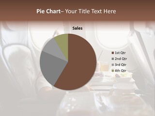 A Little Girl Sitting In An Airplane Eating A Meal PowerPoint Template