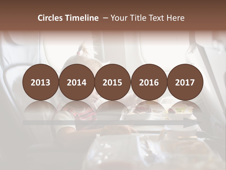 A Little Girl Sitting In An Airplane Eating A Meal PowerPoint Template