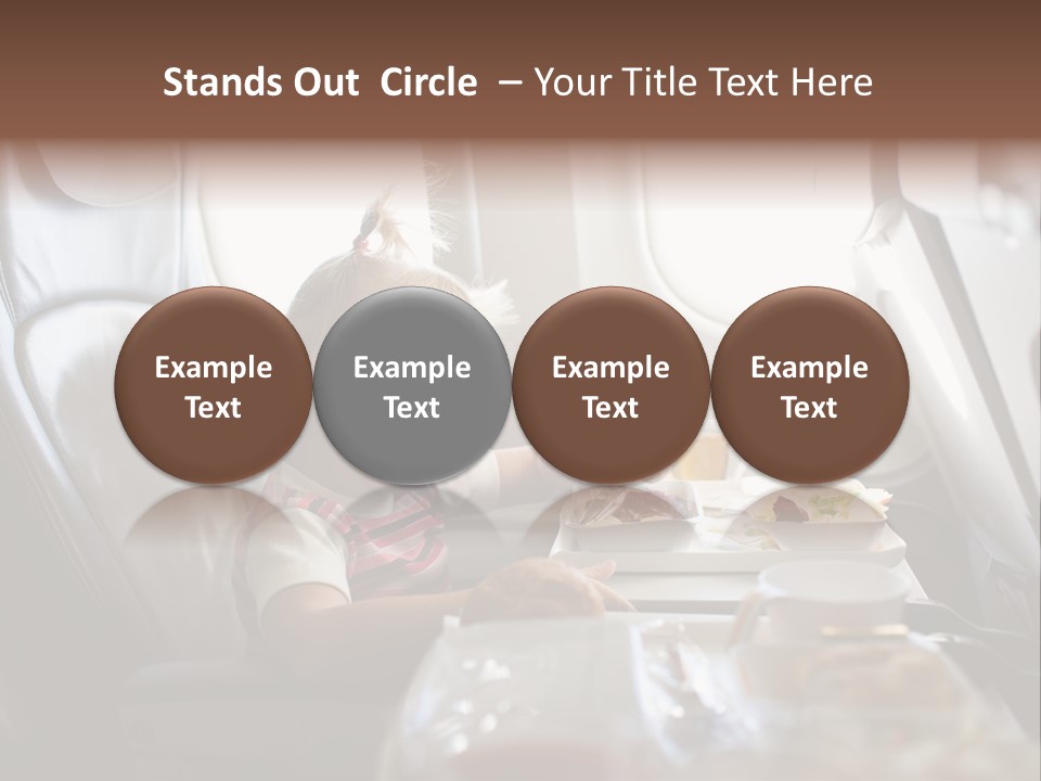 A Little Girl Sitting In An Airplane Eating A Meal PowerPoint Template