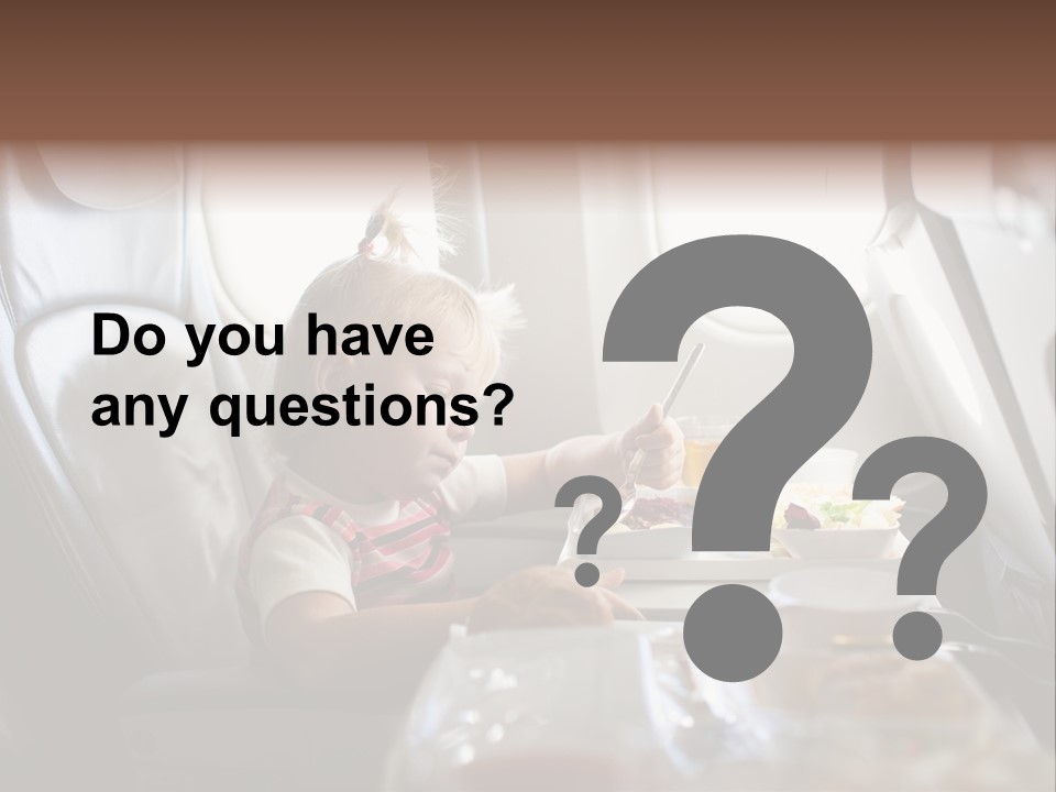 A Little Girl Sitting In An Airplane Eating A Meal PowerPoint Template