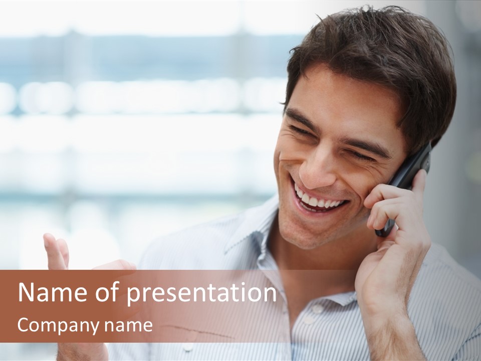 A Smiling Man Talking On A Cell Phone PowerPoint Template