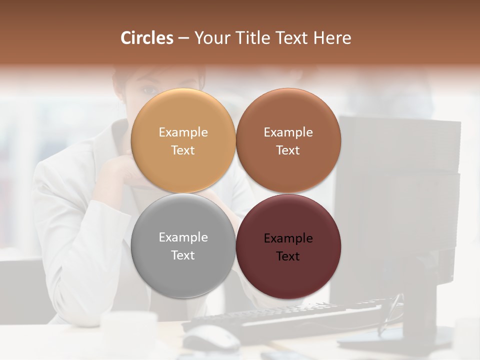 A Woman Sitting At A Desk In Front Of A Computer PowerPoint Template