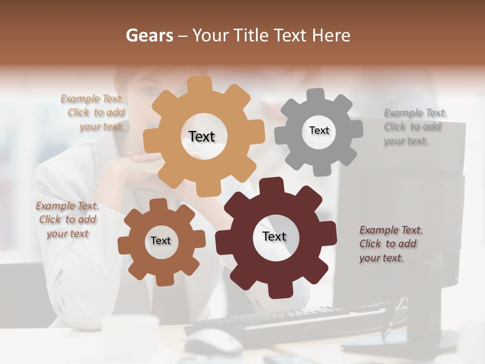 A Woman Sitting At A Desk In Front Of A Computer PowerPoint Template