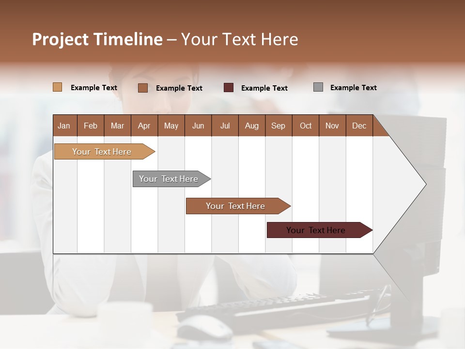 A Woman Sitting At A Desk In Front Of A Computer PowerPoint Template
