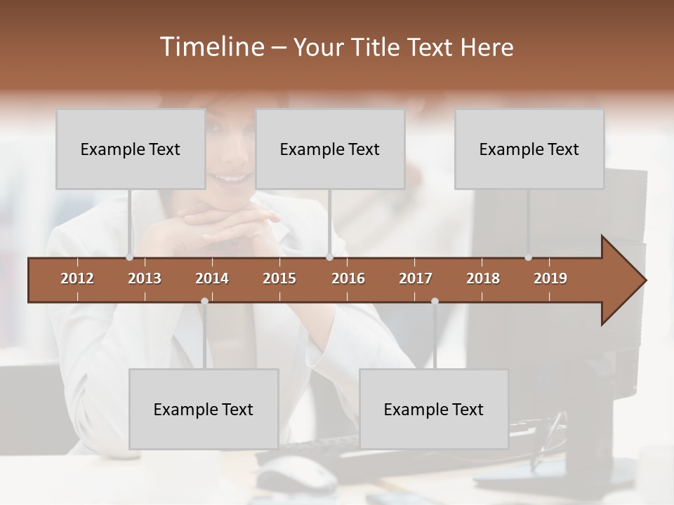 A Woman Sitting At A Desk In Front Of A Computer PowerPoint Template