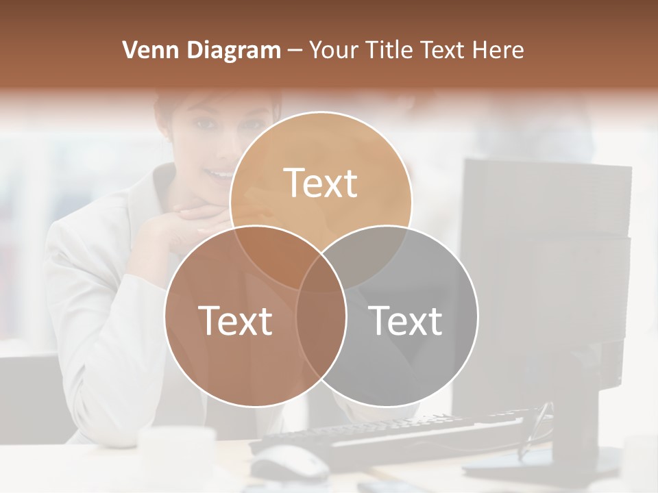 A Woman Sitting At A Desk In Front Of A Computer PowerPoint Template