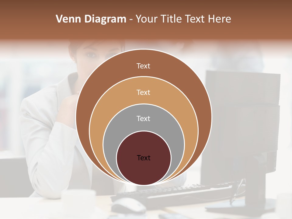 A Woman Sitting At A Desk In Front Of A Computer PowerPoint Template