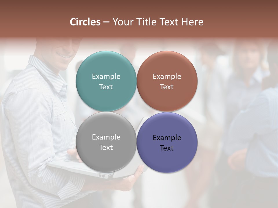 A Man Holding A Laptop In Front Of A Group Of People PowerPoint Template